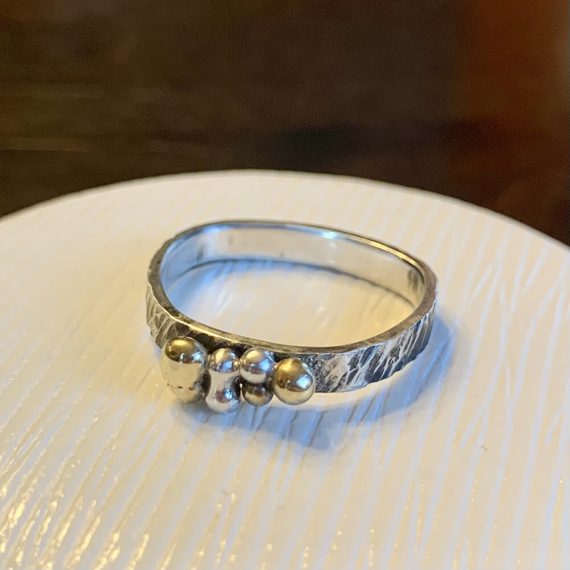 Hammered and oxidized ring shank with fine silver and bronze alloy