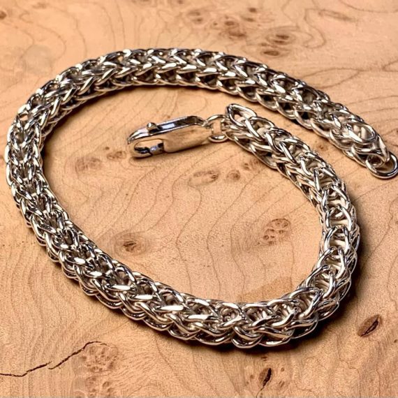 Two-way single loop-in-loop bracelet made with sterling silver. Polished.