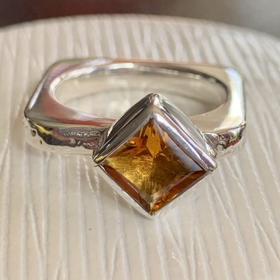 Sand-casted sterling silver with a square cut citrine set in fine silver