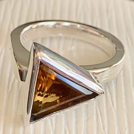 Sand-casted sterling silver with a triangle citrine stone set in fine silver