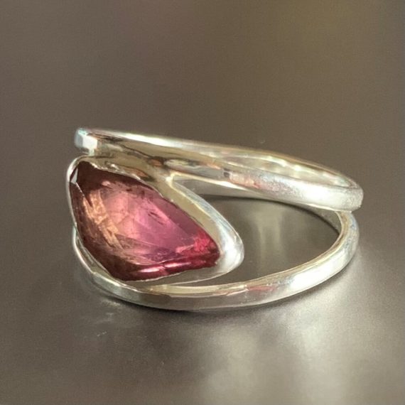 Tourmaline stone set between two sterling silver bands